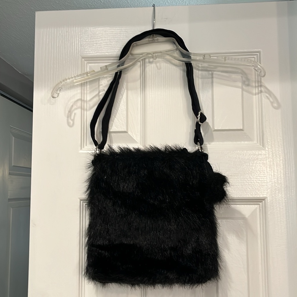 Cute Black faux fur handbag. Silver tone hardware & faux suede adjustable strap